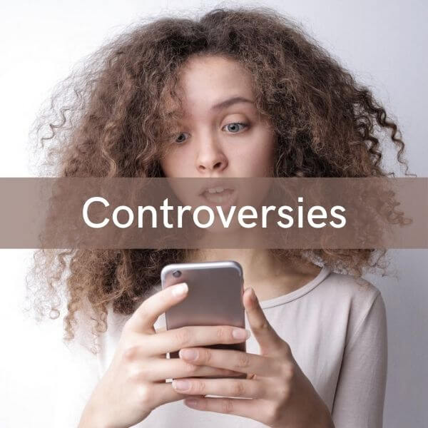 Image of girl staring into her phone to represent controversies