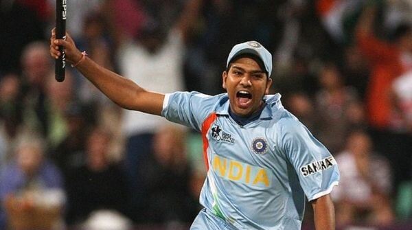 Young Rohit celebrating with a stump in his hand after win against Australia in WT20