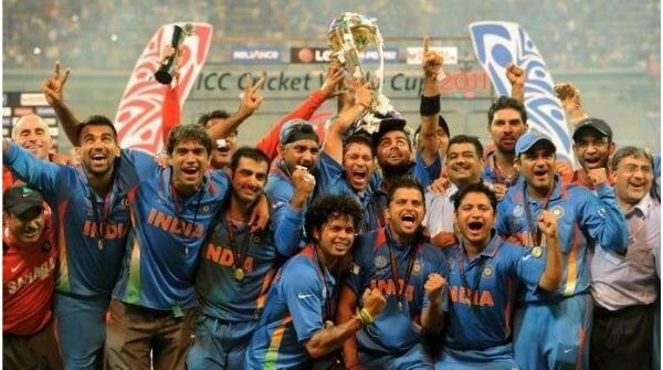World Cup 2011 highlights where Indian team posing with the trophy of 2011 Cricket World Cup after winning over the scoreboard.