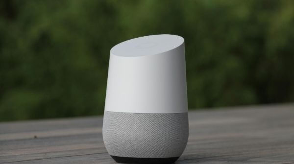 White Google Home speaker with complete focus on it and blurred background shows how cool it looks.