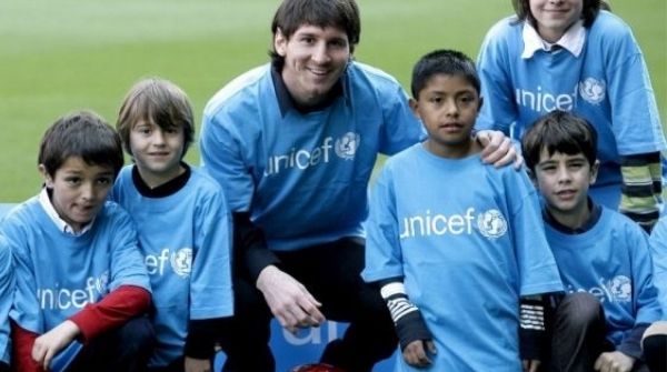 Image of Leo with kids he helped by being the UNICEF Brand Ambassador