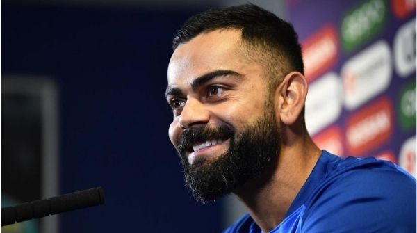 A smiling picture Virat Kohli during one his press conferences  adressing them on behalf of the entire team.